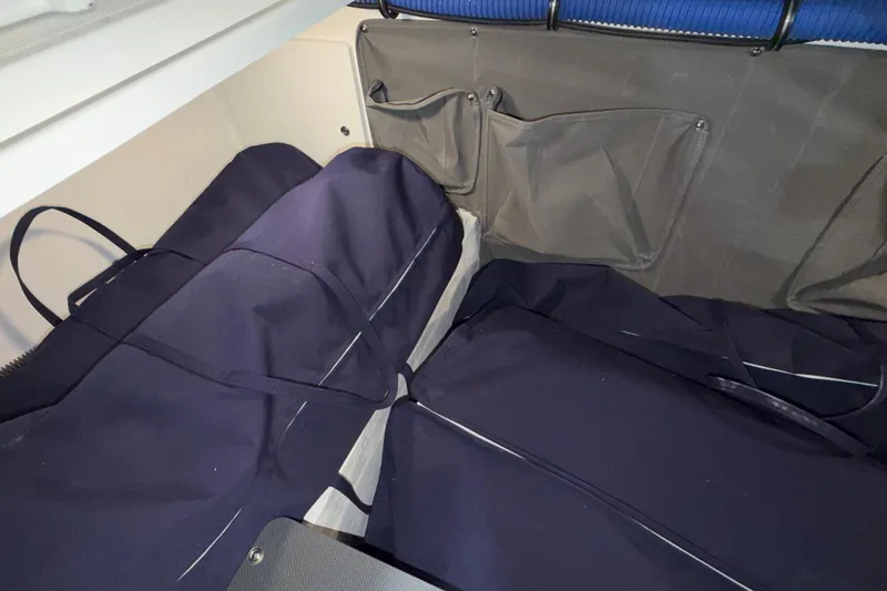Slide: The Image of Storage area in 2027 Formula 330 Crossover Bowrider I/O with bags and pockets. - 28
