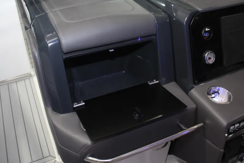 Slide: The Image of Interior of 2027 Formula 330 Crossover Bowrider I/O with open storage compartment. - 61