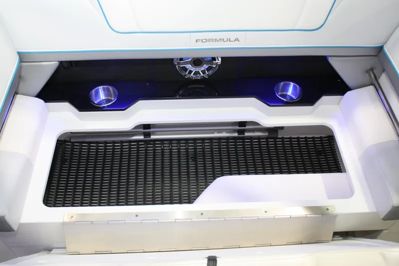 Slide: The Image of 2027 Formula 330 Crossover Bowrider I/O interior with cup holders and speaker. - 26