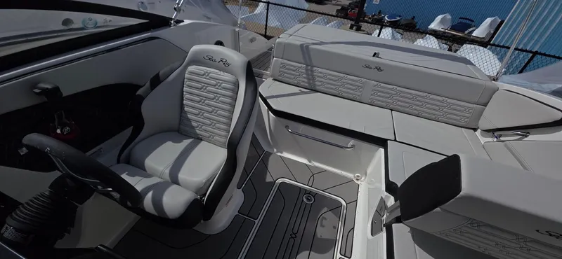 Slide: The Image of 2025 Sea Ray SPX 190 boat interior with sleek seating and modern design. - 12