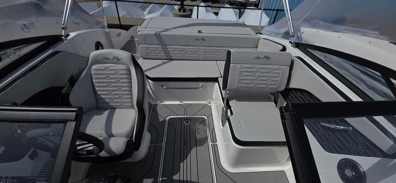 Slide: The Image of 2025 Sea Ray SPX 190 boat interior with modern seating and sleek design. - 13