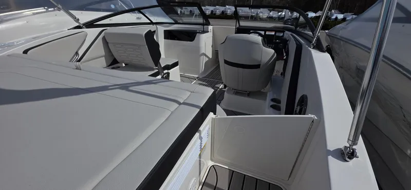 Slide: The Image of 2025 Sea Ray SPX 190 boat interior with sleek seating and modern design. - 6