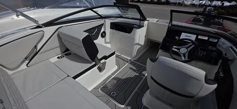 Slide: The Image of Interior of 2025 Sea Ray SPX 190 boat, featuring sleek seating and modern dashboard. - 8
