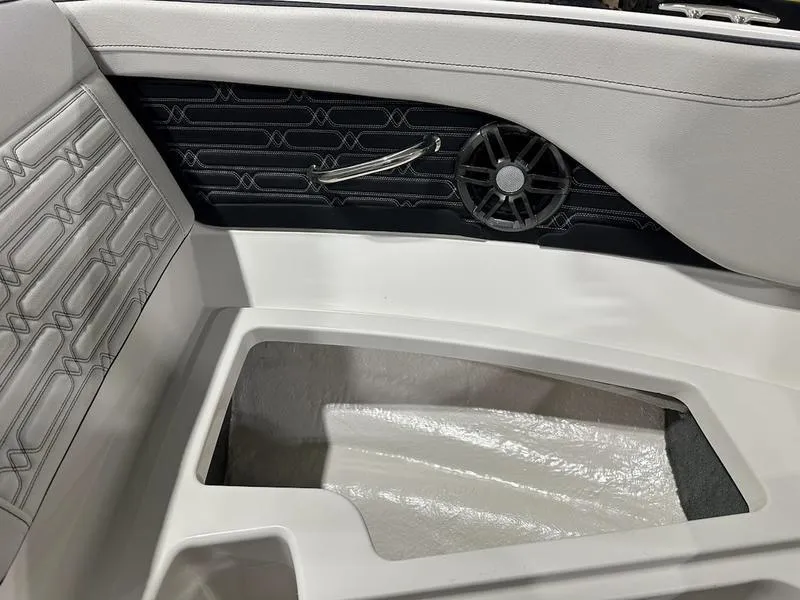 Slide: The Image of 2025 Sea Ray SPX 190 OB interior with speaker and storage compartment. - 10