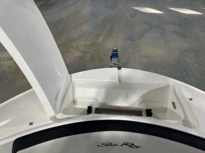 Slide: The Image of 2025 Sea Ray SPX 190 OB boat with open storage compartment. - 11
