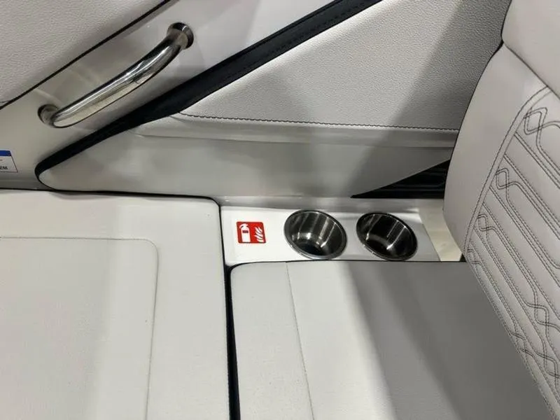 Slide: The Image of 2025 Sea Ray SPX 190 OB interior with cup holders and sleek design. - 15