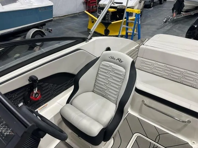 Slide: The Image of 2025 Sea Ray SPX 190 OB boat interior with sleek seating and modern design. - 5