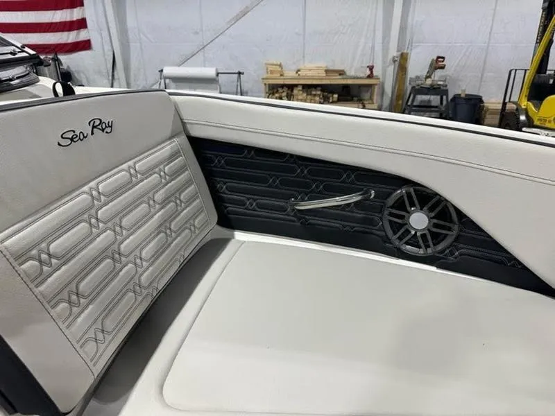 Slide: The Image of 2025 Sea Ray SPX 190 OB boat interior with stylish seating and speaker detail. - 9