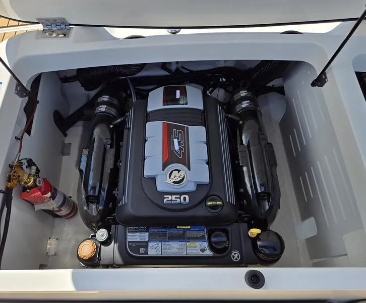 Slide: The Image of 2025 Sea Ray SPX 210 engine compartment with 250 horsepower engine. - 2