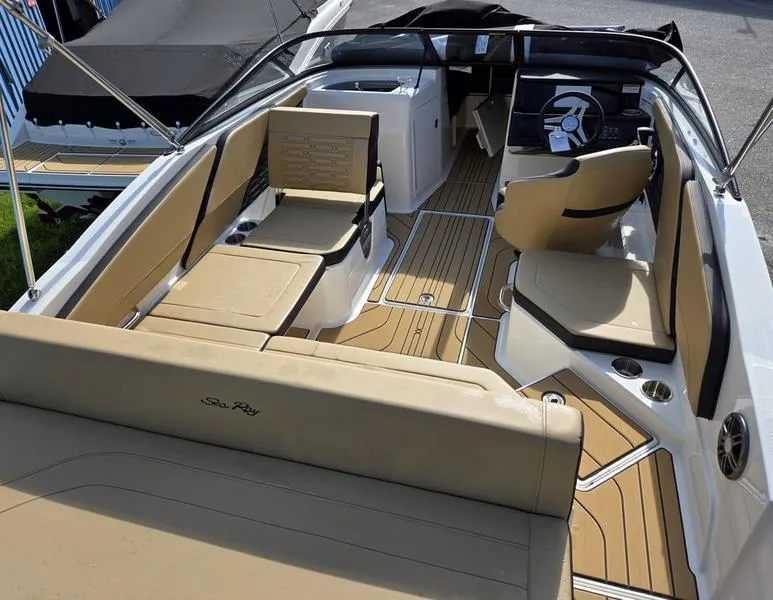 Slide: The Image of 2025 Sea Ray SPX 210 Outboard with 200 V6 engine, featuring sleek design and wooden deck. - 3