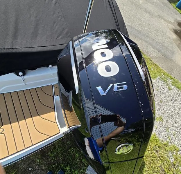 Slide: The Image of 2025 Sea Ray SPX 210 Outboard interior with tan seating and stylish design. - 4