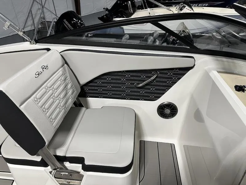 Slide: The Image of 2025 Sea Ray SPX 210 OB boat interior with sleek seating and modern design. - 11