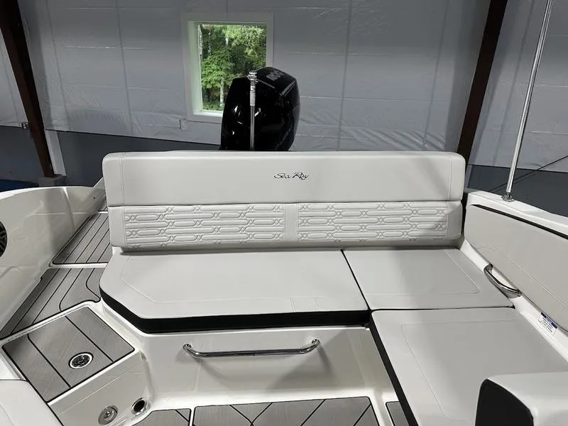 Slide: The Image of 2025 Sea Ray SPX 210 OB boat interior with sleek seating and modern design. - 8