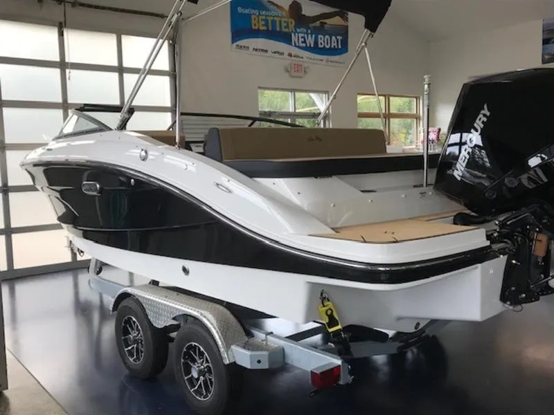 Slide: The Image of 2025 Sea Ray SPX 210 OB boat on trailer in showroom. - 4