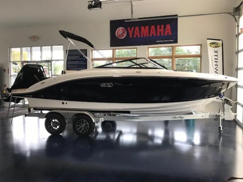 Slide: The Image of 2025 Sea Ray SPX 210 OB boat on trailer in showroom. - 5