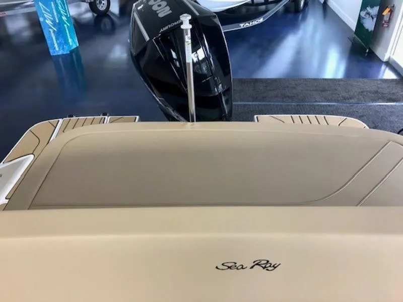 Slide: The Image of 2025 Sea Ray SPX 210 OB boat interior with outboard motor in showroom. - 8