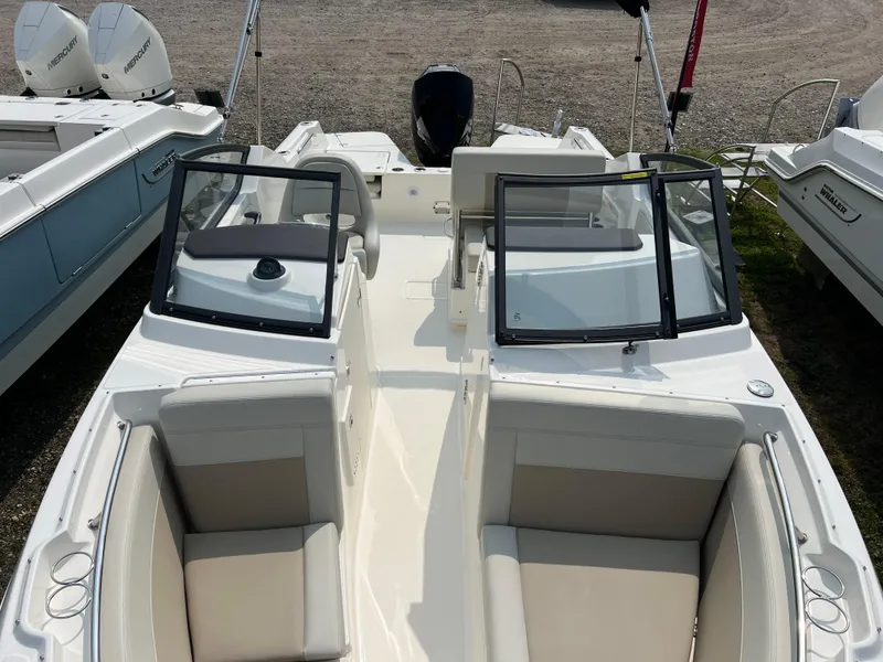 Slide: The Image of 2025 Boston Whaler 210 Vantage boat interior with dual consoles and seating. - 16