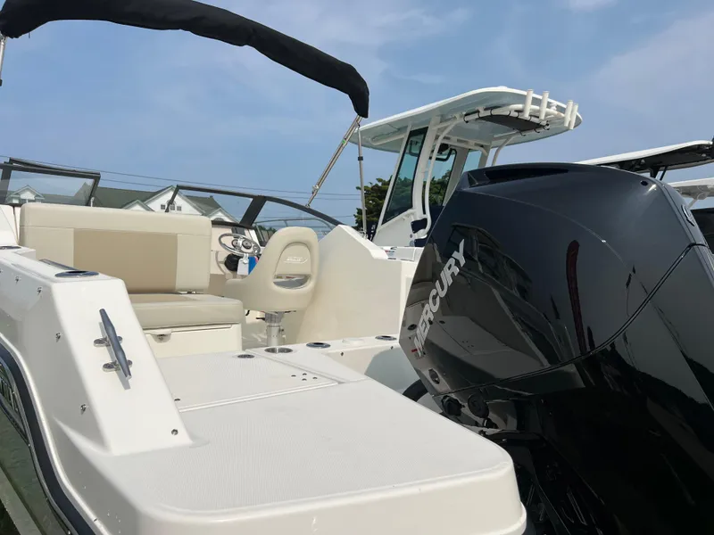 Slide: The Image of 2025 Boston Whaler 210 Vantage boat with Mercury engine, featuring spacious seating and modern design. - 17