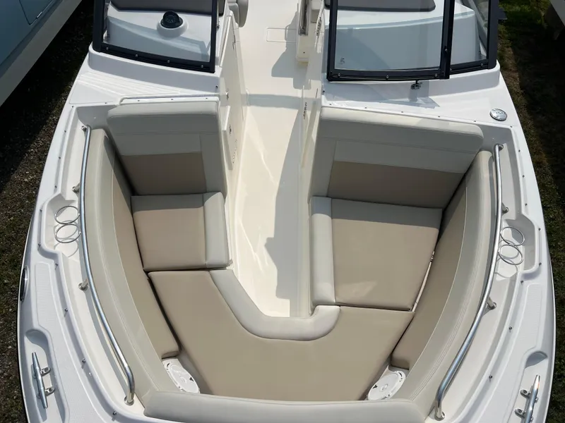 Slide: The Image of 2025 Boston Whaler 210 Vantage boat with spacious seating and sleek design. - 19