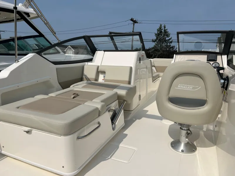 Slide: The Image of 2025 Boston Whaler 210 Vantage boat interior with seating and helm. - 6