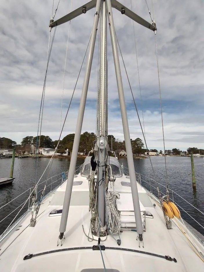 Slide: The Image of Sailboat deck view of 2005 Stevens Custom 53/56, docked with visible mast and rigging. - 11