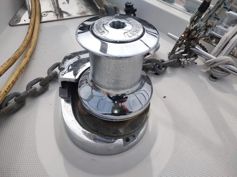 Slide: The Image of Chrome winch on a 2005 Stevens Custom 53/56 sailboat deck with ropes and chains. - 17