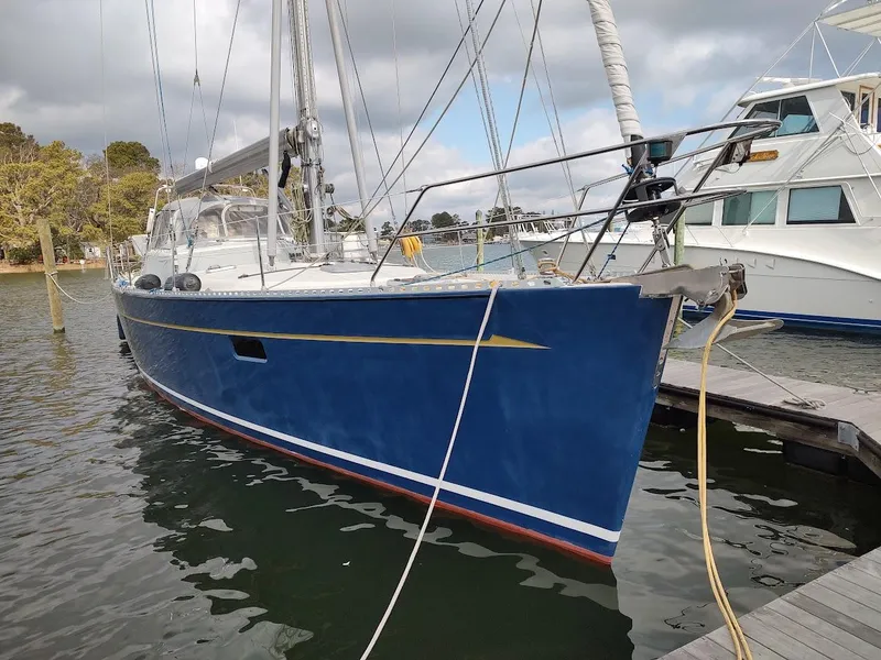 Slide: The Image of Blue 2005 Stevens Custom 53/56 sailboat docked at marina, cloudy sky background. - 2