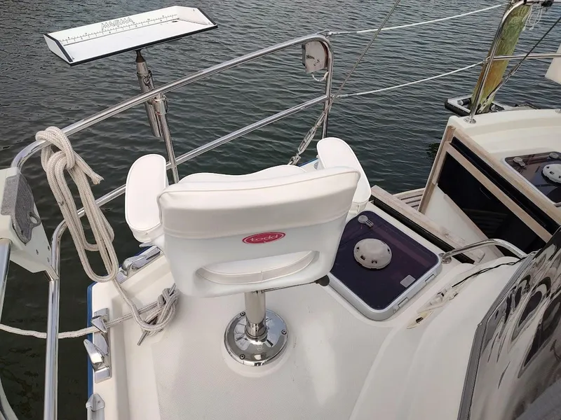 Slide: The Image of Stevens Custom 53/56 yacht deck with white chair and railing, 2005 model. - 21