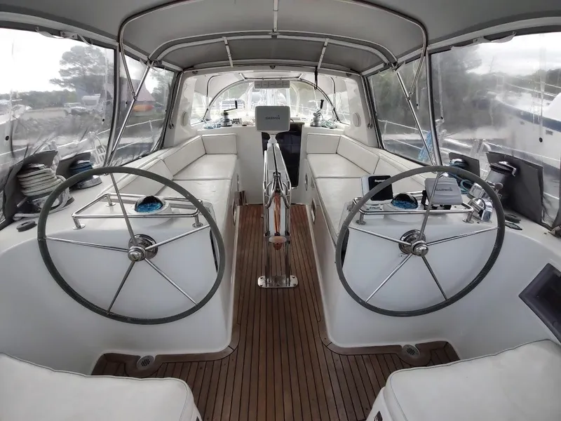 Slide: The Image of Interior of 2005 Stevens Custom 53/56 yacht with dual steering wheels and wooden flooring. - 27