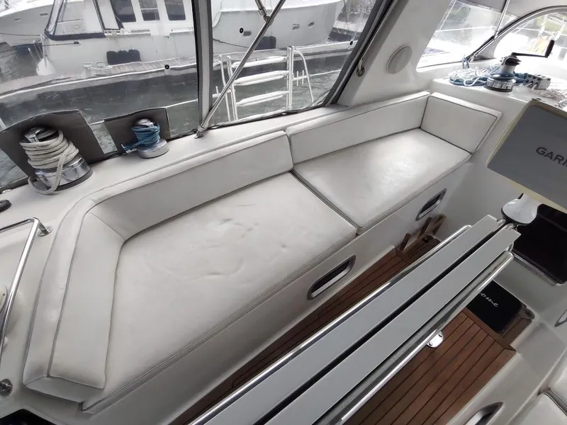 Slide: The Image of Interior of 2005 Stevens Custom 53/56 yacht with white seating and nautical equipment. - 30