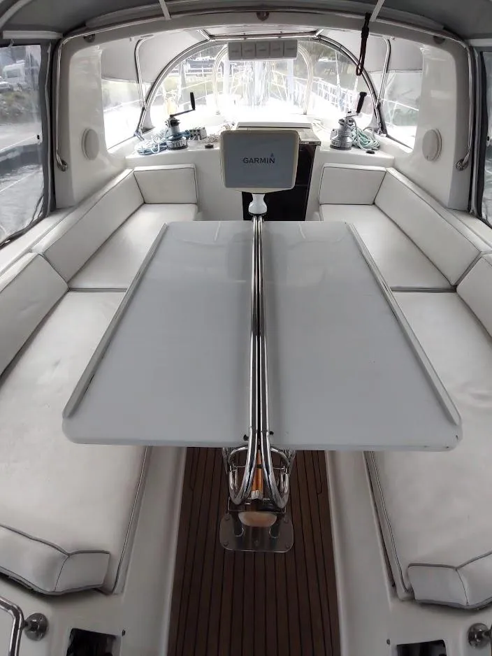 Slide: The Image of Luxurious interior of 2005 Stevens Custom 53/56 yacht with white seating and navigation equipment. - 33