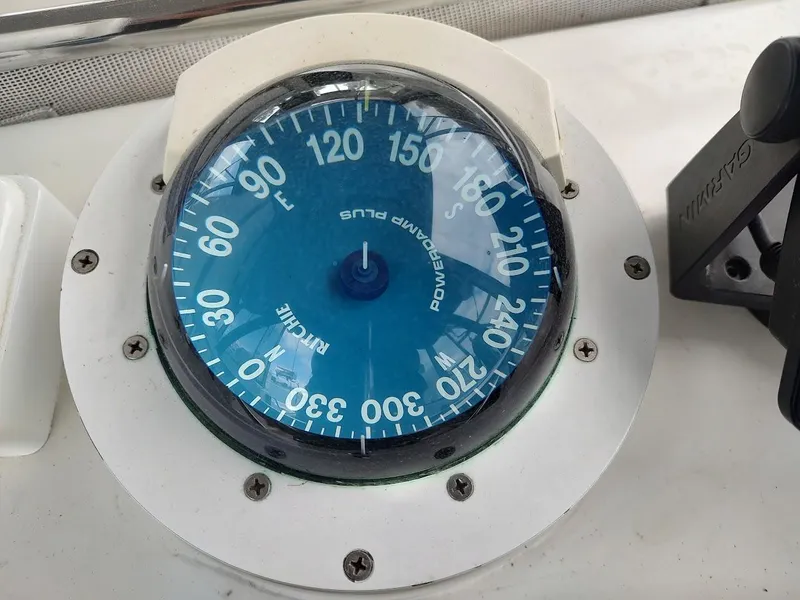 Slide: The Image of Boat compass on Stevens Custom 53/56, 2005 model, showing cardinal directions. - 45