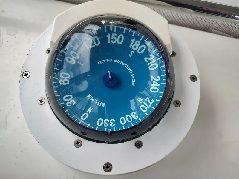 Slide: The Image of Close-up of a blue marine compass on a Stevens Custom 53/56 boat, 2005 model. - 46