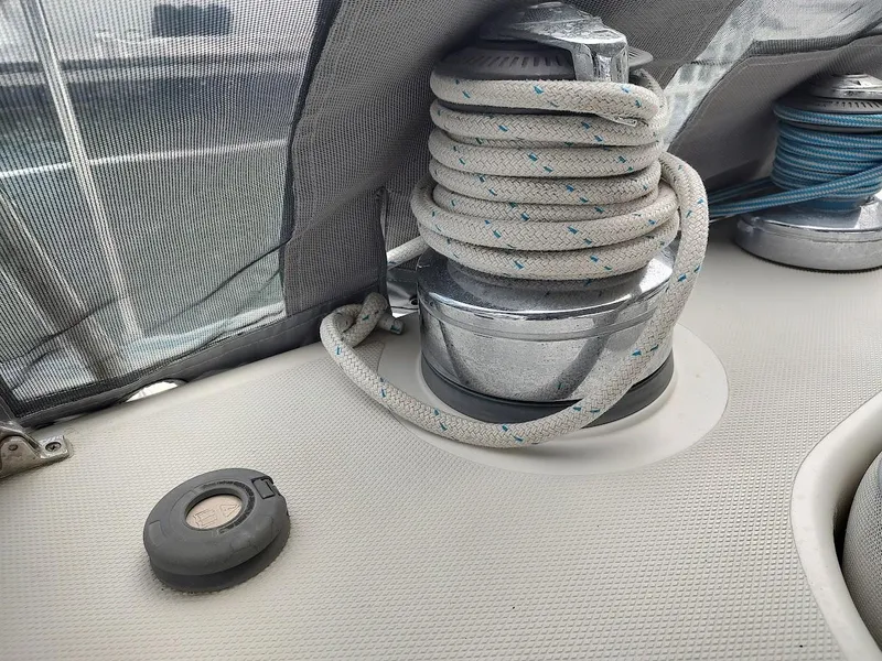 Slide: The Image of Close-up of a winch with coiled rope on a 2005 Stevens Custom 53/56 sailboat. - 47