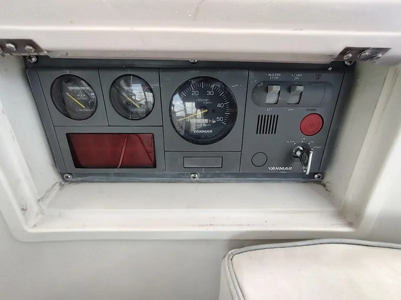 Slide: The Image of Control panel of a 2005 Stevens Custom 53/56 boat with Yanmar engine gauges. - 49