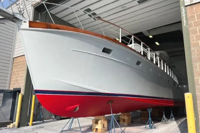 Slide: The Image of 1970 Huckins Offshore yacht in dry dock for maintenance. - 4