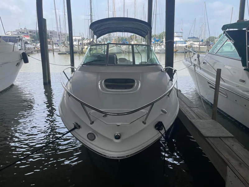 Slide: The Image of 2008 Sea Ray 240 Sundancer docked in a marina. - 16