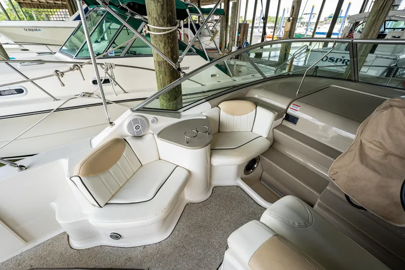 Slide: The Image of Interior seating area of a 2008 Sea Ray 240 Sundancer boat in a marina. - 7
