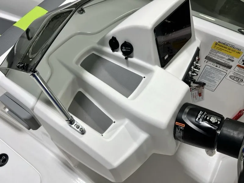 Slide: The Image of 2024 Tahoe T18 boat dashboard with controls and display screen. - 12