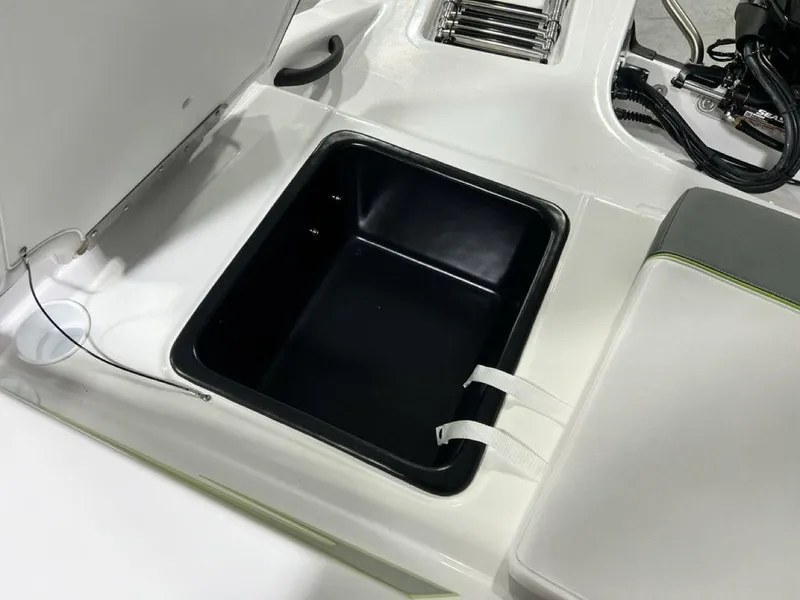 Slide: The Image of 2024 Tahoe T18 boat storage compartment with open lid. - 16