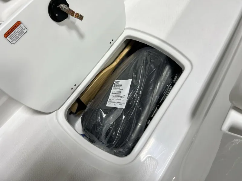 Slide: The Image of 2024 Tahoe T18 storage compartment with equipment inside. - 6