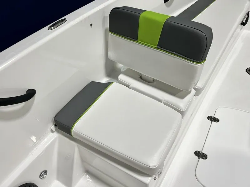 Slide: The Image of 2024 Tahoe T18 boat interior with white, gray, and green cushioned seats. - 8