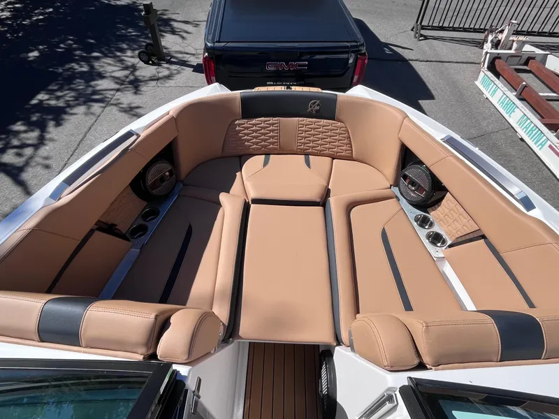 Slide: The Image of 2024 MasterCraft X24 boat with luxurious tan leather seating. - 11