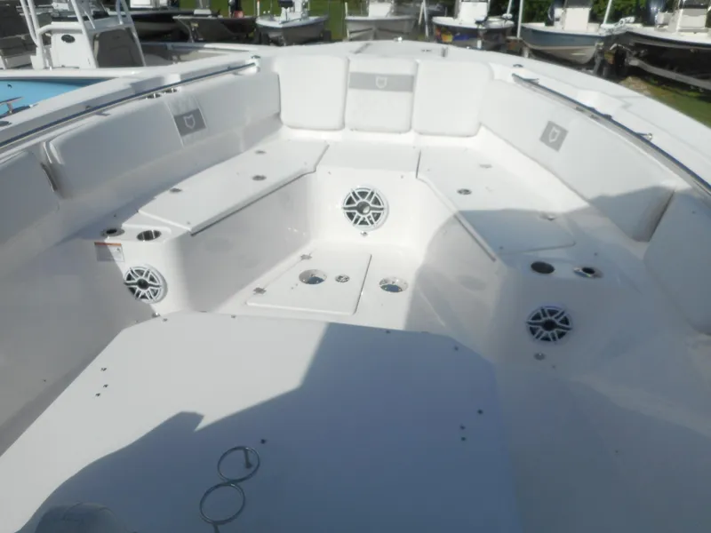 Slide: The Image of 2024 Sea Fox 328 Commander boat interior with spacious seating and built-in speakers. - 10