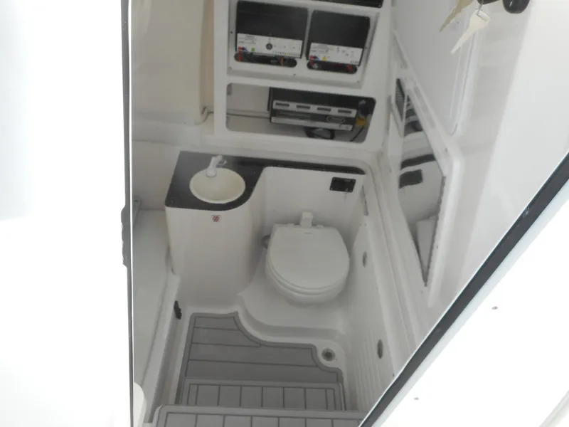 Slide: The Image of 2024 Sea Fox 328 Commander boat interior bathroom with toilet and sink. - 13