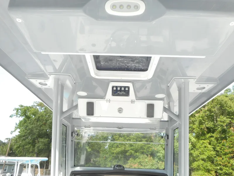 Slide: The Image of 2024 Sea Fox 328 Commander boat interior ceiling with lighting and storage. - 8