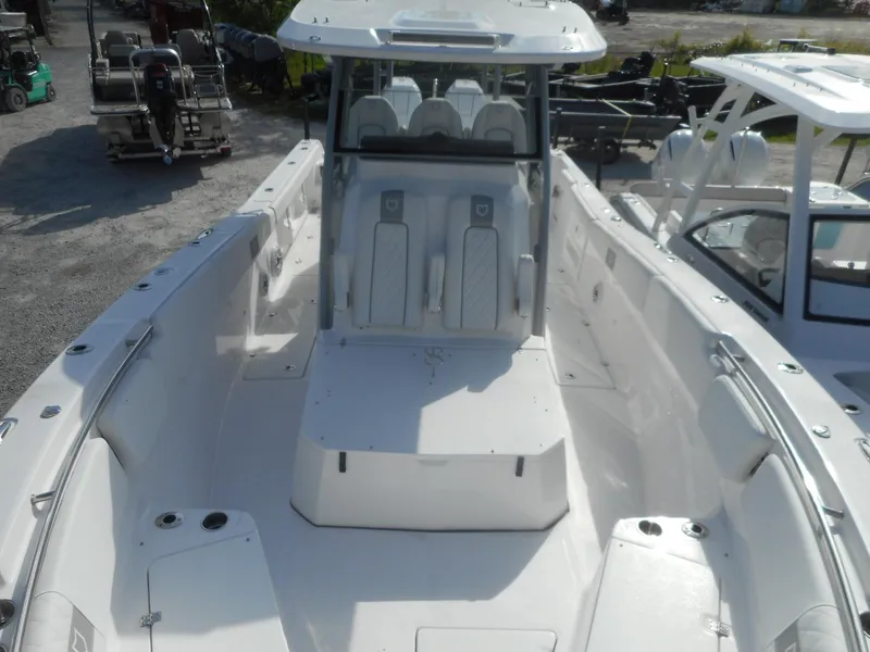 Slide: The Image of 2024 Sea Fox 328 Commander boat interior with seating and console. - 9