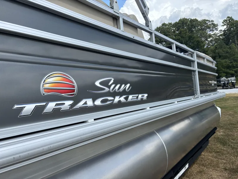 Slide: The Image of 2024 Sun Tracker Party Barge 22 RF DLX pontoon boat, side view with logo. - 10