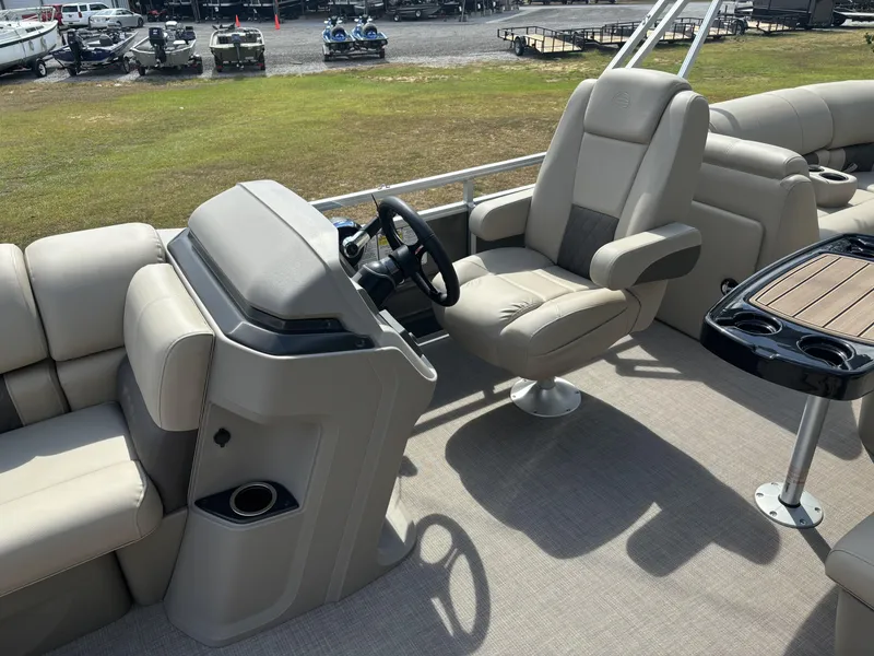 Slide: The Image of 2024 Sun Tracker Party Barge 22 RF DLX interior with helm and seating area. - 13