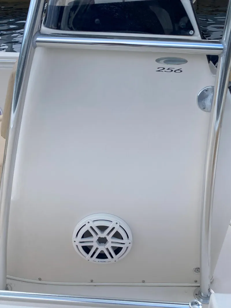 Slide: The Image of 2008 Cobia 256 Center Console boat with speaker and model number visible. - 35